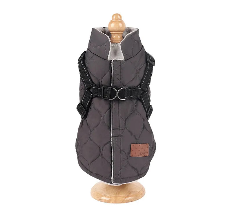 Gray quilted dog coat on a mannequin with a white background