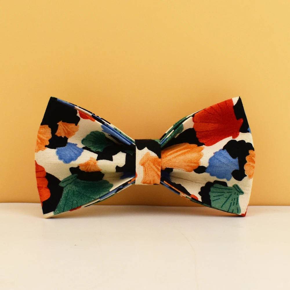 Colorful floral-patterned bow tie on a beige background