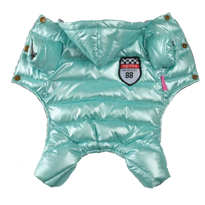 Light blue puffer dog coat with patches on a white background