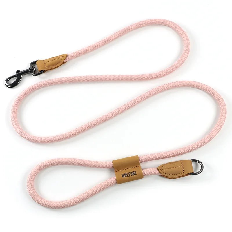 Pink dog leash with brown leather ends and 'Wolfdog' branding on a white background