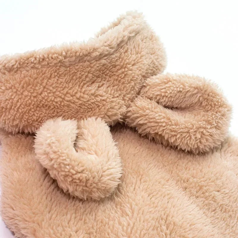 Close-up of a beige fluffy blanket with a white background