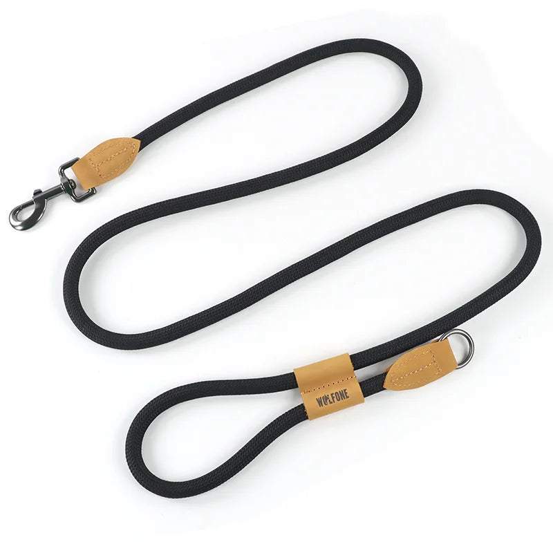 Black dog leash with brown leather ends and 'Wolfdog' branding on a white background