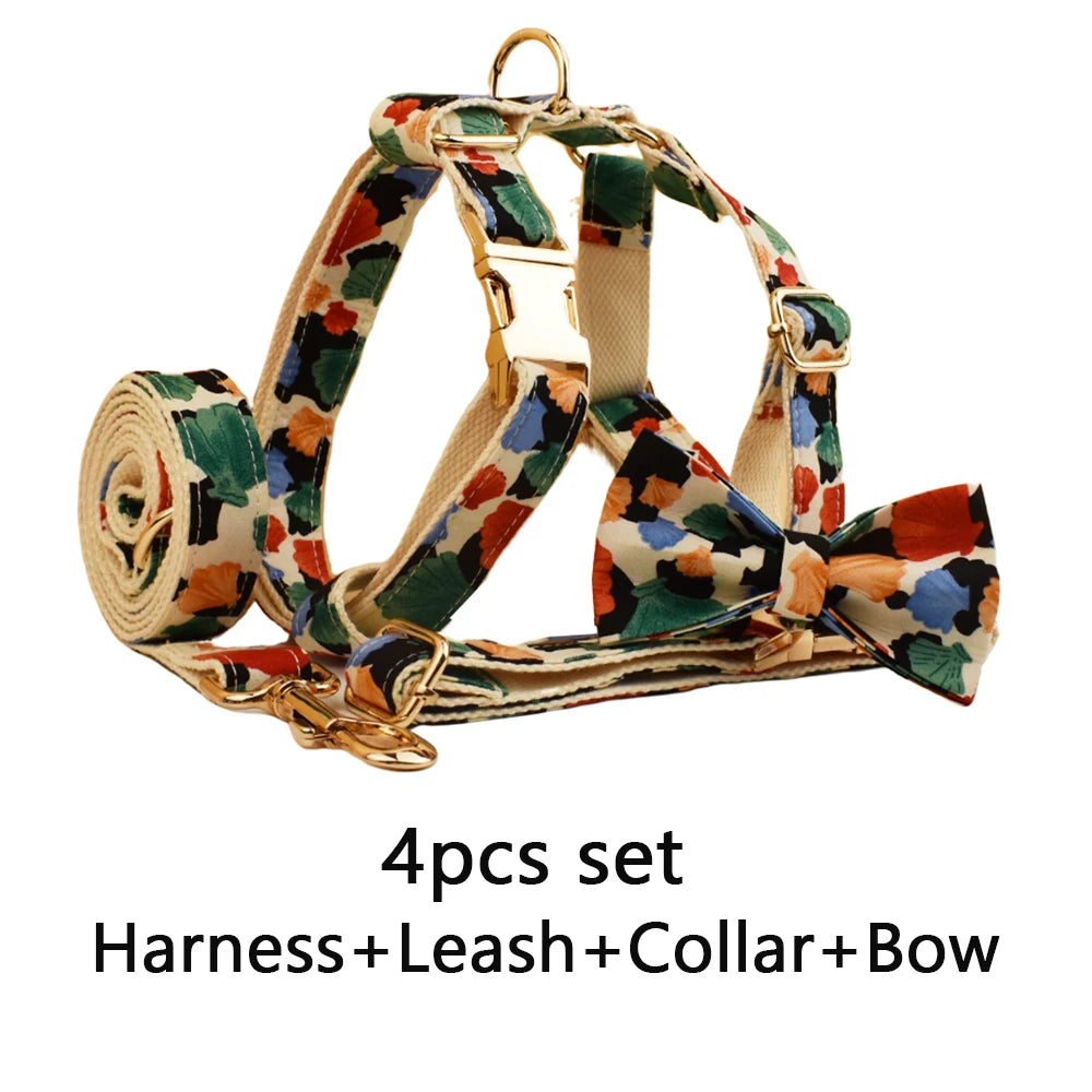 Dog harness, leash, collar, and bow tie set with geometric pattern on a white background