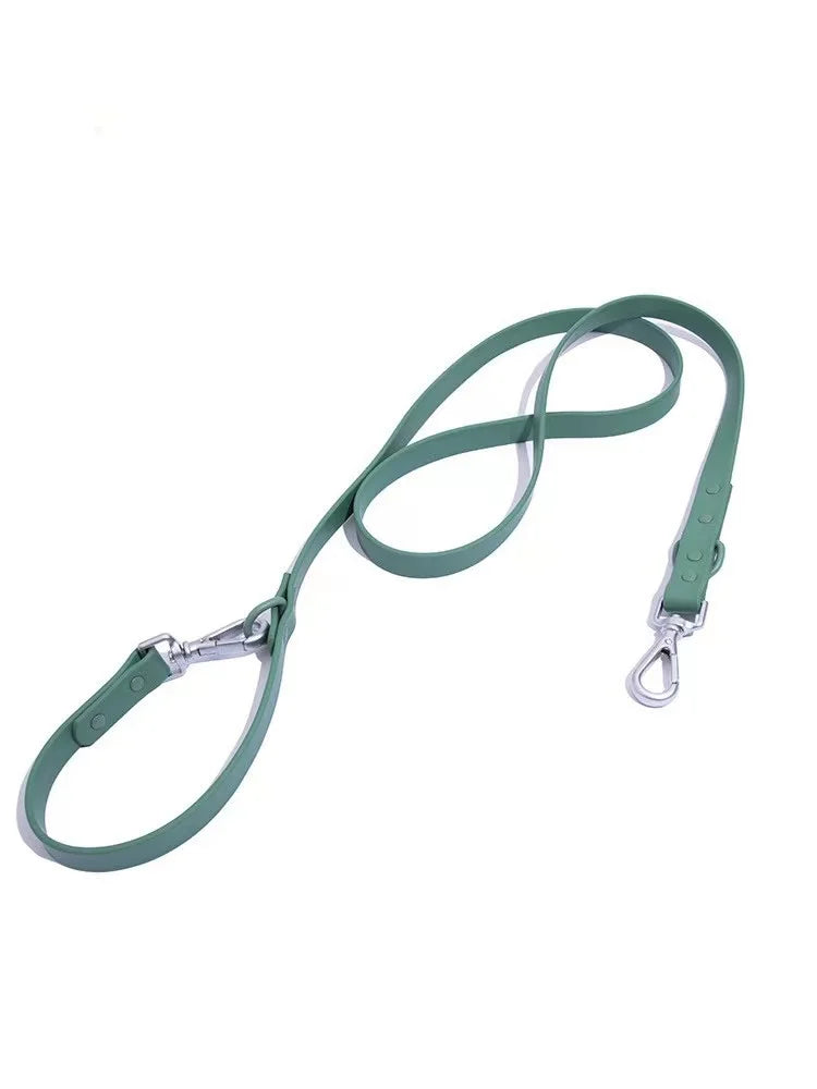 Green dog leash with metal clip on a white background