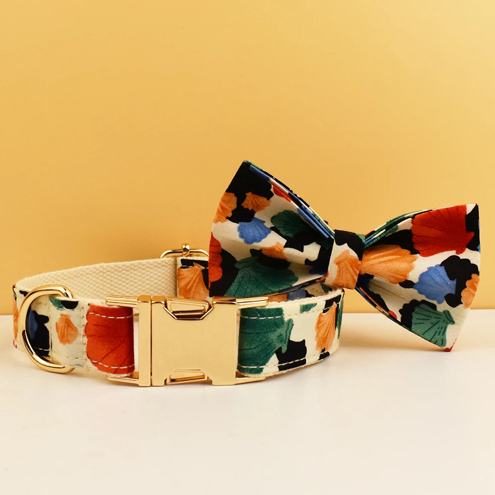 Floral-patterned dog collar and bow tie set on a yellow background