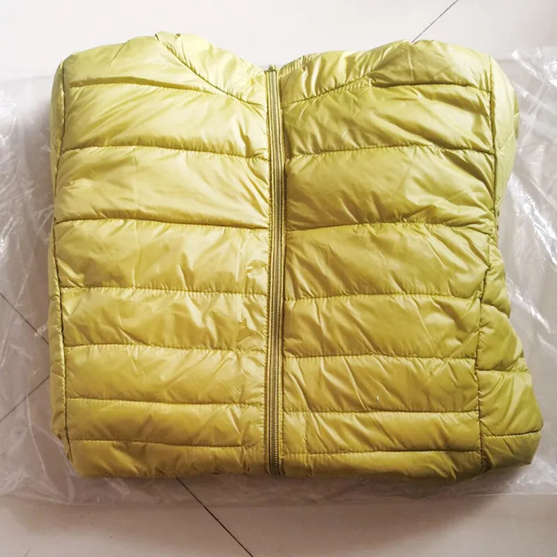 Yellow puffer jacket on a white background