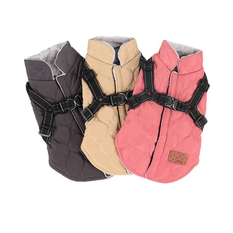 Three dog harnesses in gray, beige, and pink on a white background