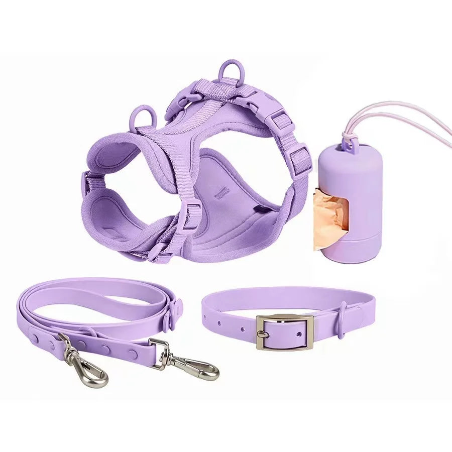 Purple dog harness, leash, and collar set on a white background
