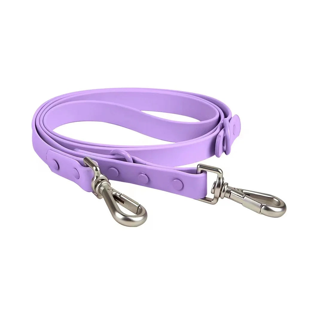 Purple dog leash with silver clasp on a white background
