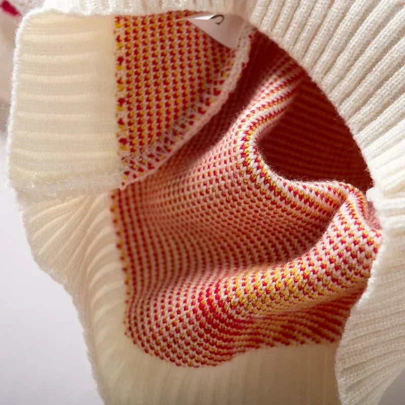 Close-up of a textured fabric with a visible brand tag on a white background