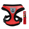 Red dog harness with gray paw patch and matching leash on a white background