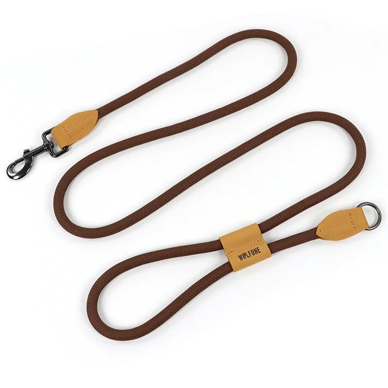 Brown dog leash with tan leather ends on a white background