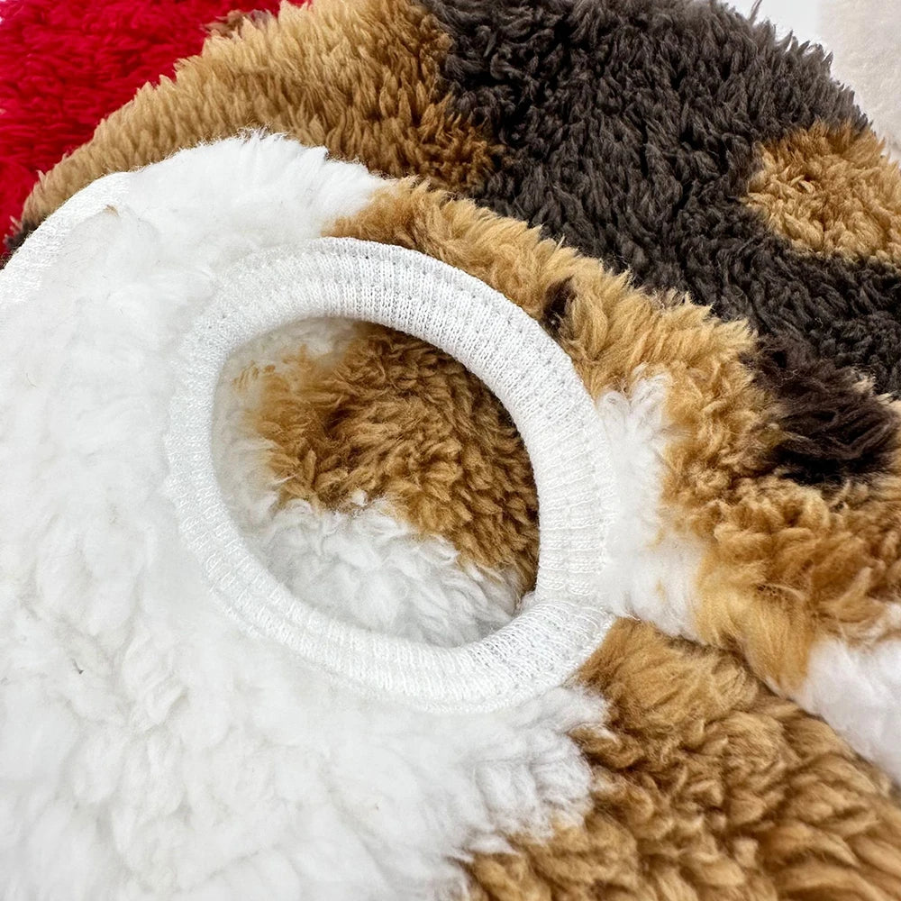 Close-up of a plush toy with brown, beige, and white fur.