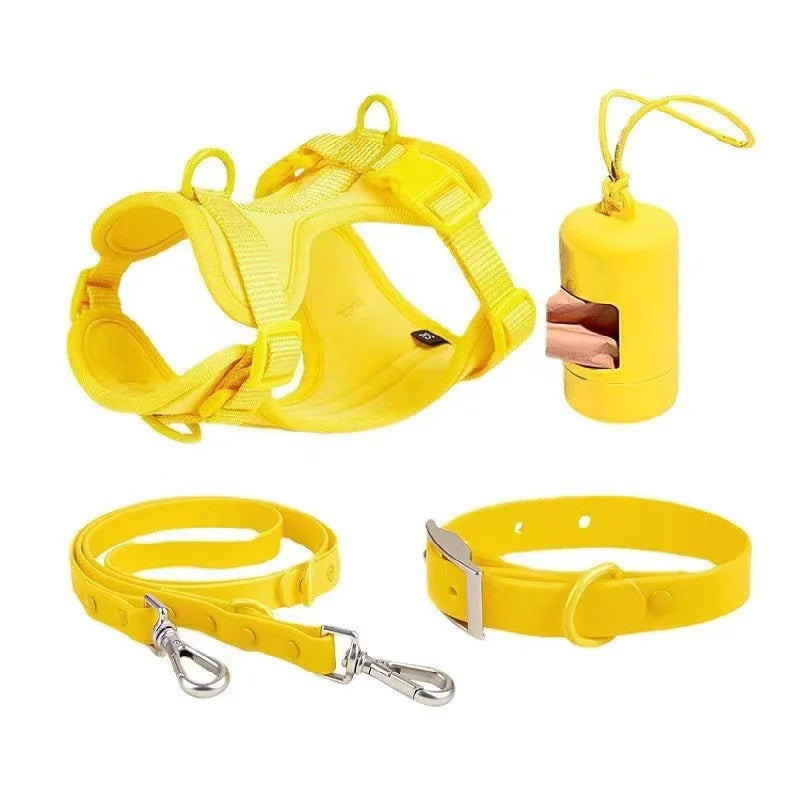 Yellow dog harness, leash, and collar set on a white background