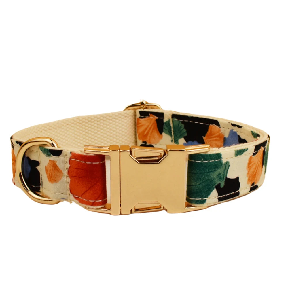 Dog collar with floral pattern and gold buckle on a white background