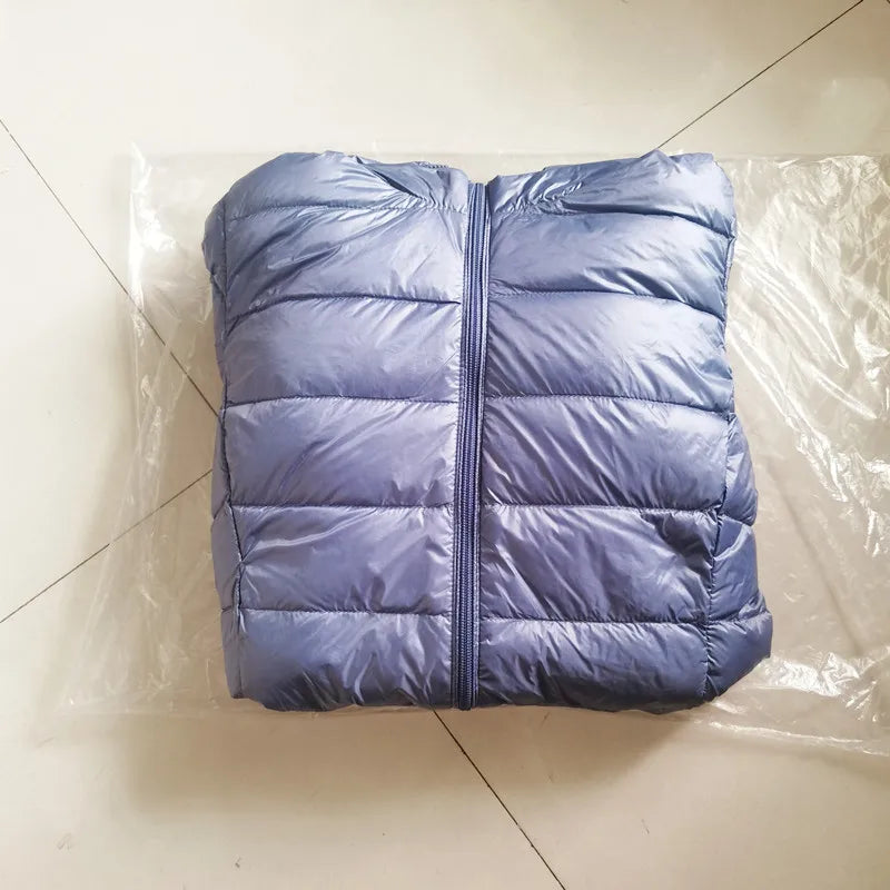 Purple puffer jacket on a tiled floor