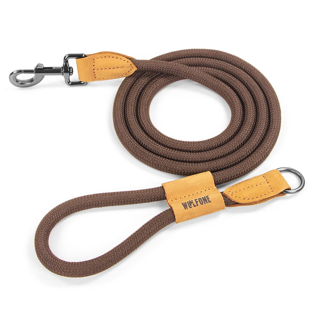 Brown dog leash with tan leather ends and metal clip on a white background