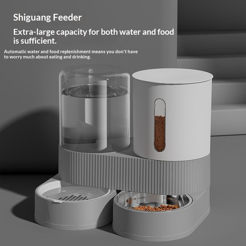 Gray pet feeder with water and food compartments on a gray background