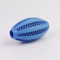 Blue rubber dog toy shaped like a football on a white background